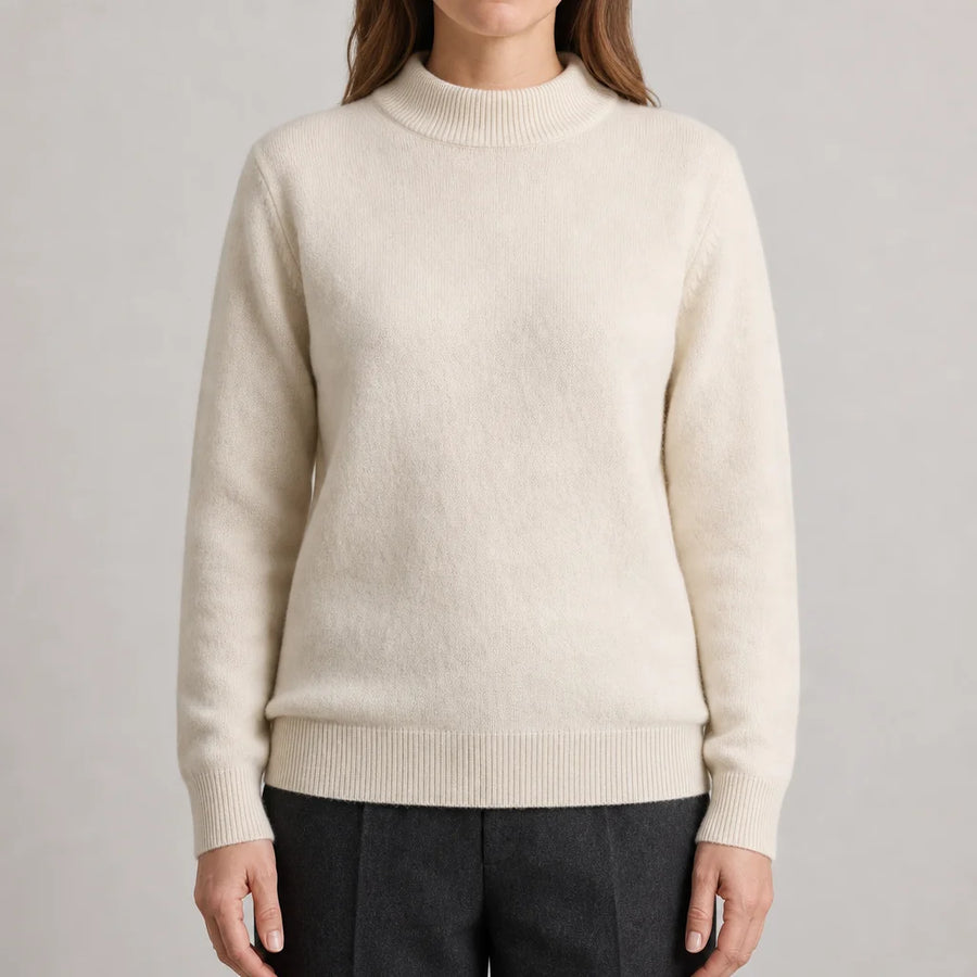 Woman wearing the Adele Relaxed Mock Neck Sweater in cream