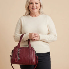 Braided Handle Tote Bag with Tassel worn by a woman with curves