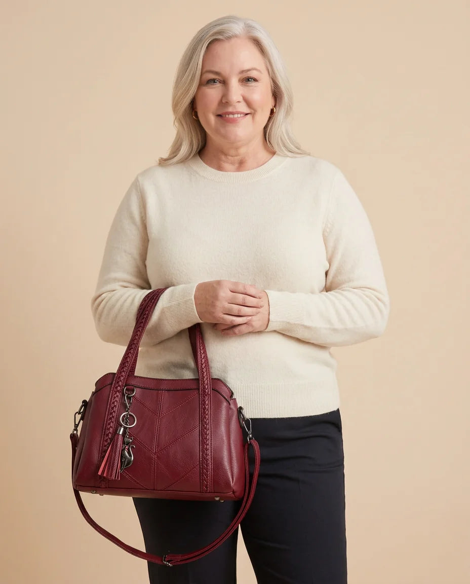 Braided Handle Tote Bag with Tassel worn by a woman with curves