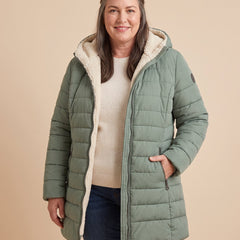 Anna | Hooded A-Line Puffer Coat worn by a woman with curves