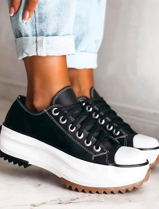 Bettina Platform Lace-Up Sneakers in Black, worn with light jeans