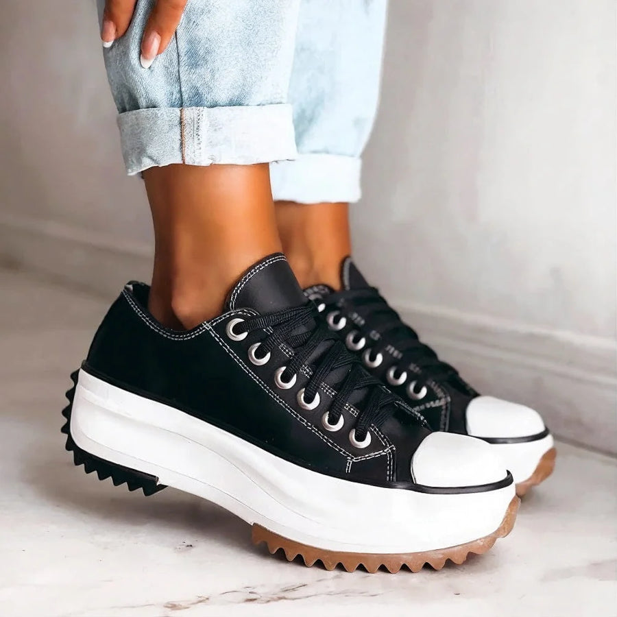 Bettina Platform Lace-Up Sneakers in Black, worn with light jeans