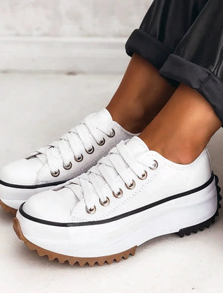 Bettina Platform Lace-Up Sneakers in White, worn with dark trousers