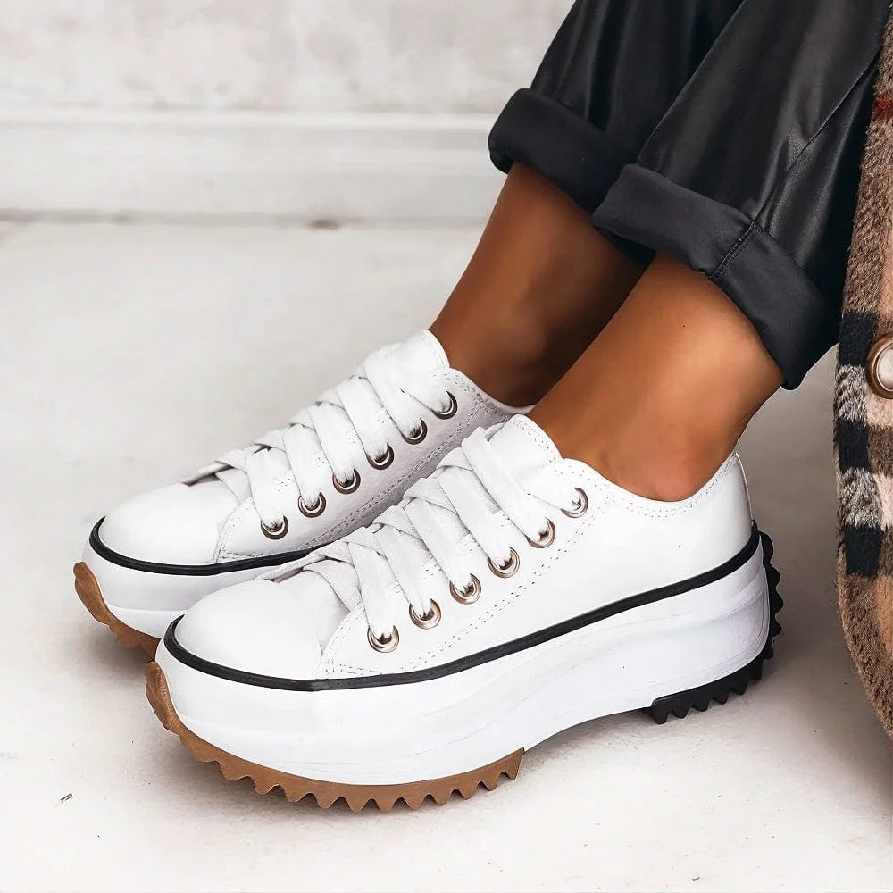 Bettina Platform Lace-Up Sneakers in White, worn with dark trousers