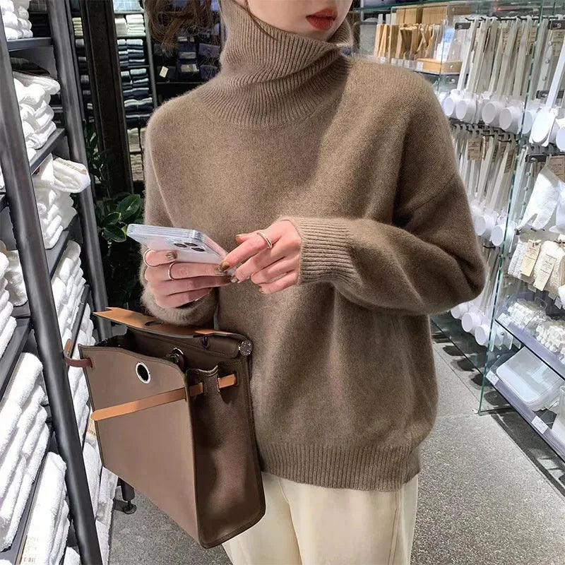 Corinne ribbed turtleneck sweater in Coffee, worn