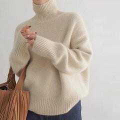 Corinne ribbed turtleneck sweater in Apricot, worn