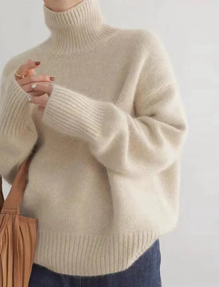 Corinne ribbed turtleneck sweater in Apricot, worn