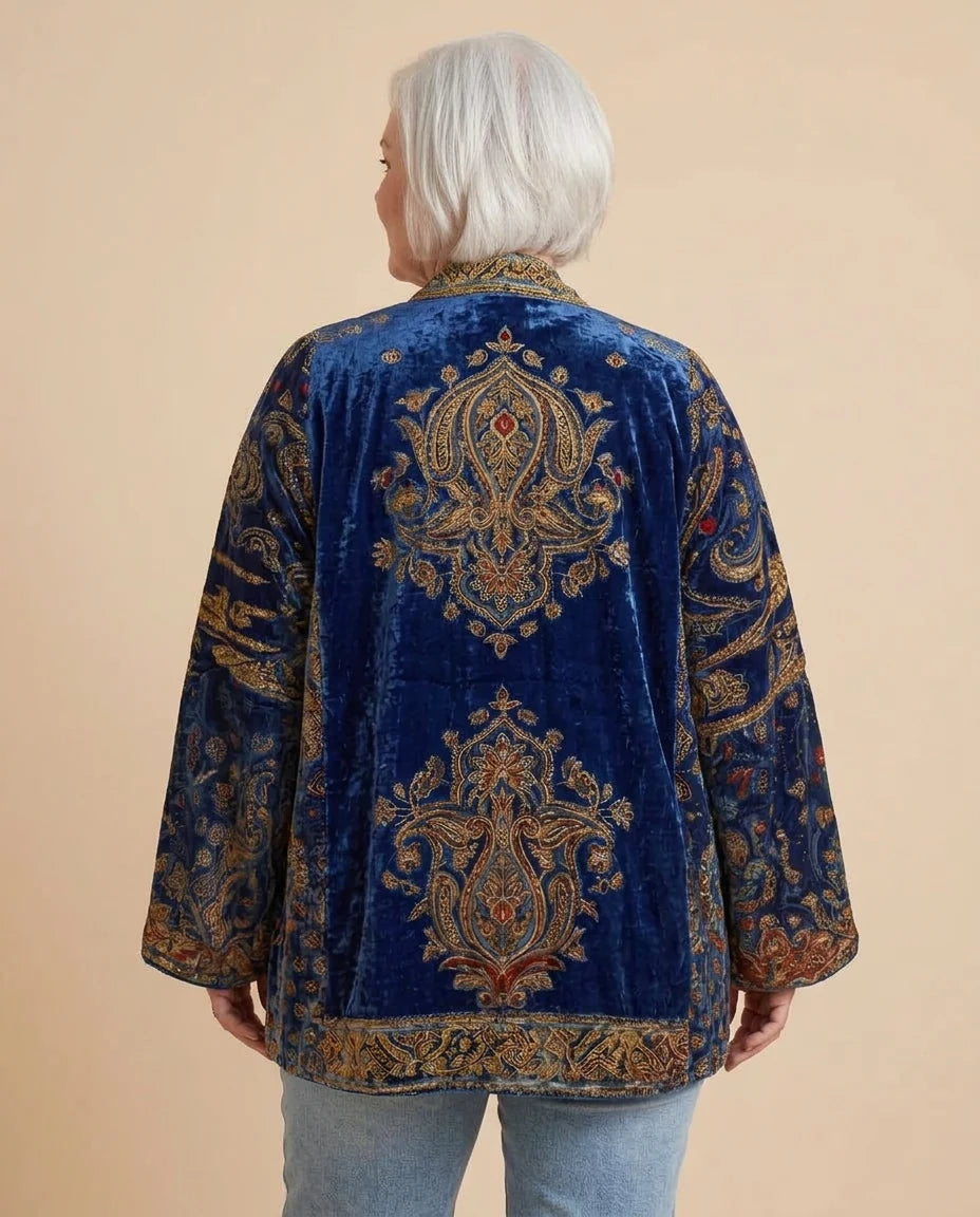 Back view of the Boho Embroidered Kimono Cardigan in Navy on a woman with curves