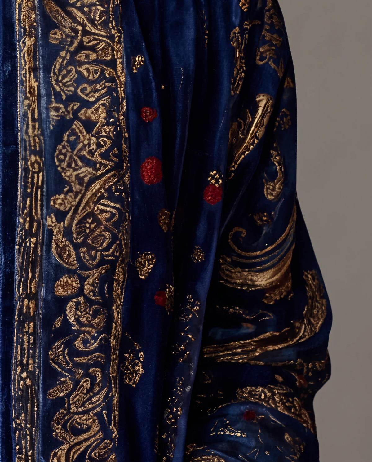 Close-up of the gold-patterned front band of the Boho Embroidered Kimono Cardigan in Navy