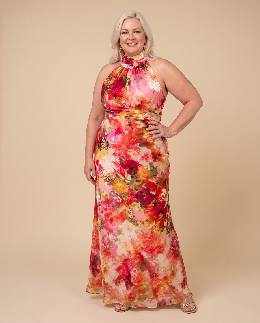 Elisabetta™ Halter Neck Floral Print Maxi Dress worn by a woman with curves