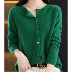 Fernanda round neck button cardigan in Dark Green, worn