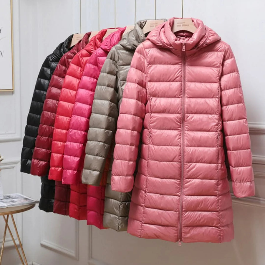 Fiona Lightweight Hooded Puffer Coat in pink, shown with other colors on a rack