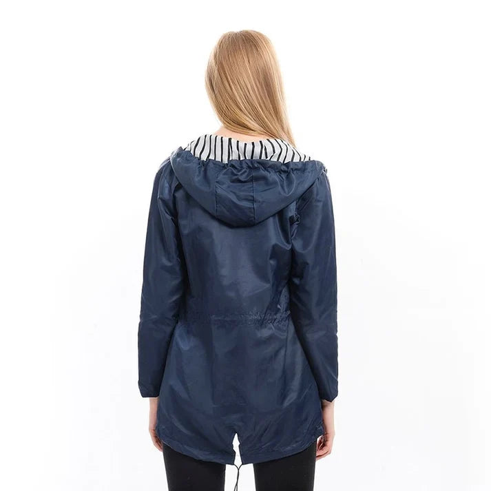 Sabrina Hooded Rain Jacket in Navy, back view on model