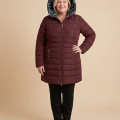 Hilary | Long Hooded Quilted Puffer Coat worn by a woman with curves