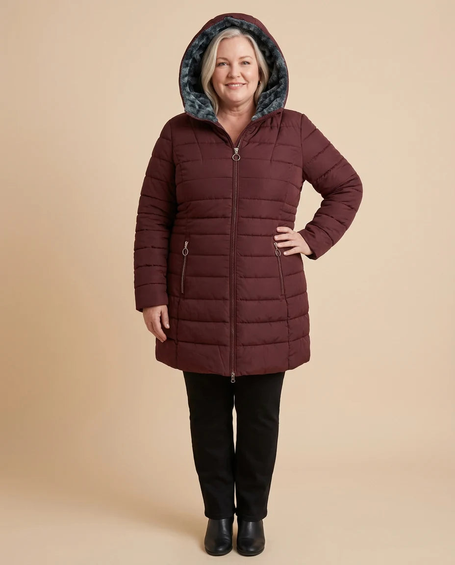 Hilary | Long Hooded Quilted Puffer Coat worn by a woman with curves