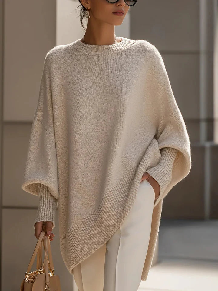 Lucia oversized asymmetric hem sweater in beige, worn
