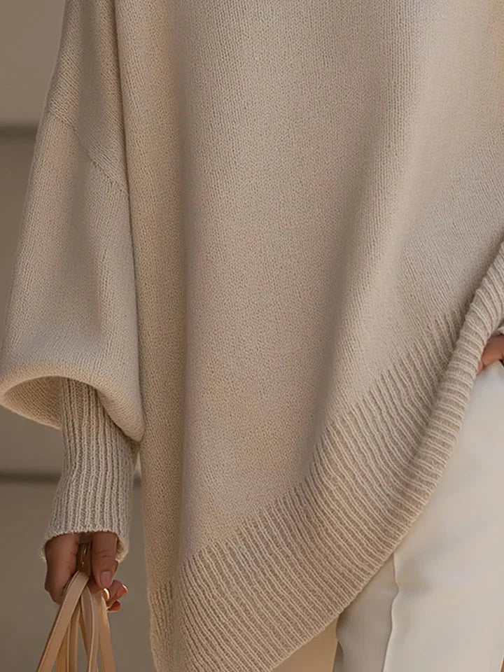 Lucia oversized asymmetric hem sweater in beige, hem detail