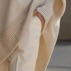 Lucia oversized asymmetric hem sweater in beige, sleeve detail