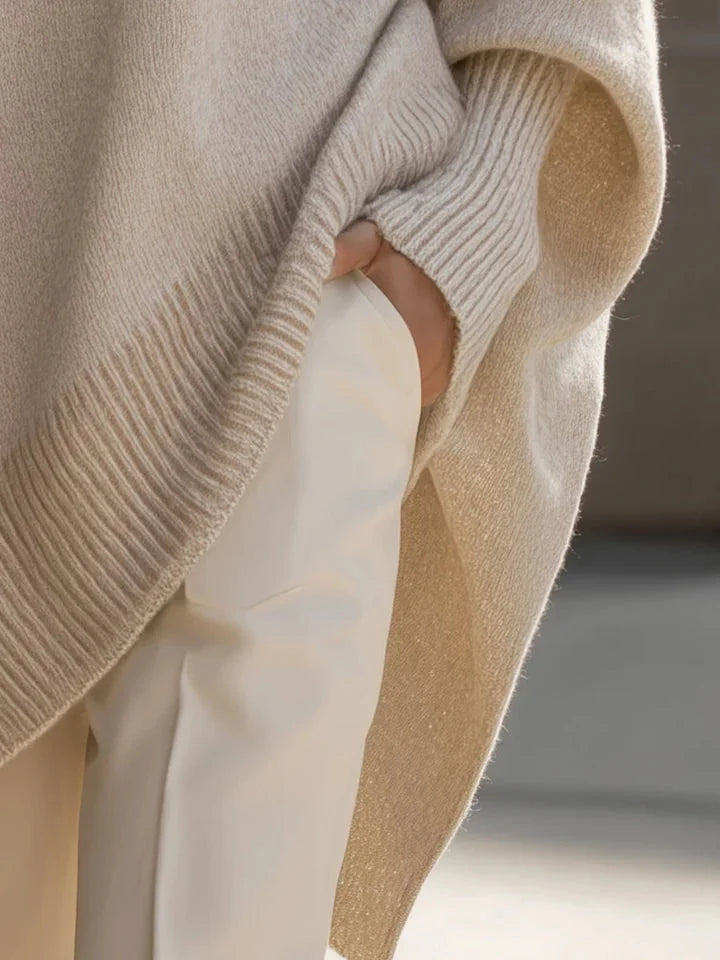 Lucia oversized asymmetric hem sweater in beige, sleeve detail