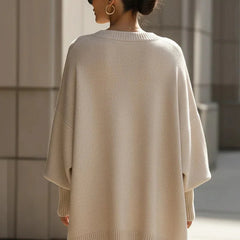 Lucia oversized asymmetric hem sweater in beige, worn back