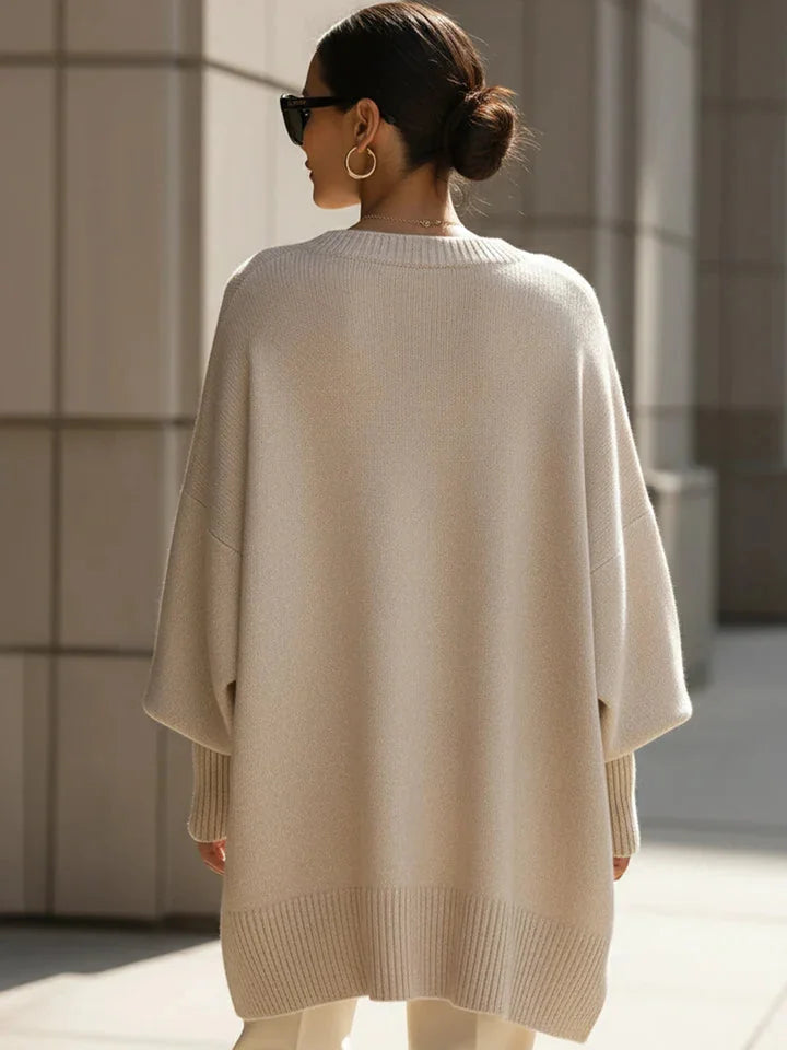 Lucia oversized asymmetric hem sweater in beige, worn back