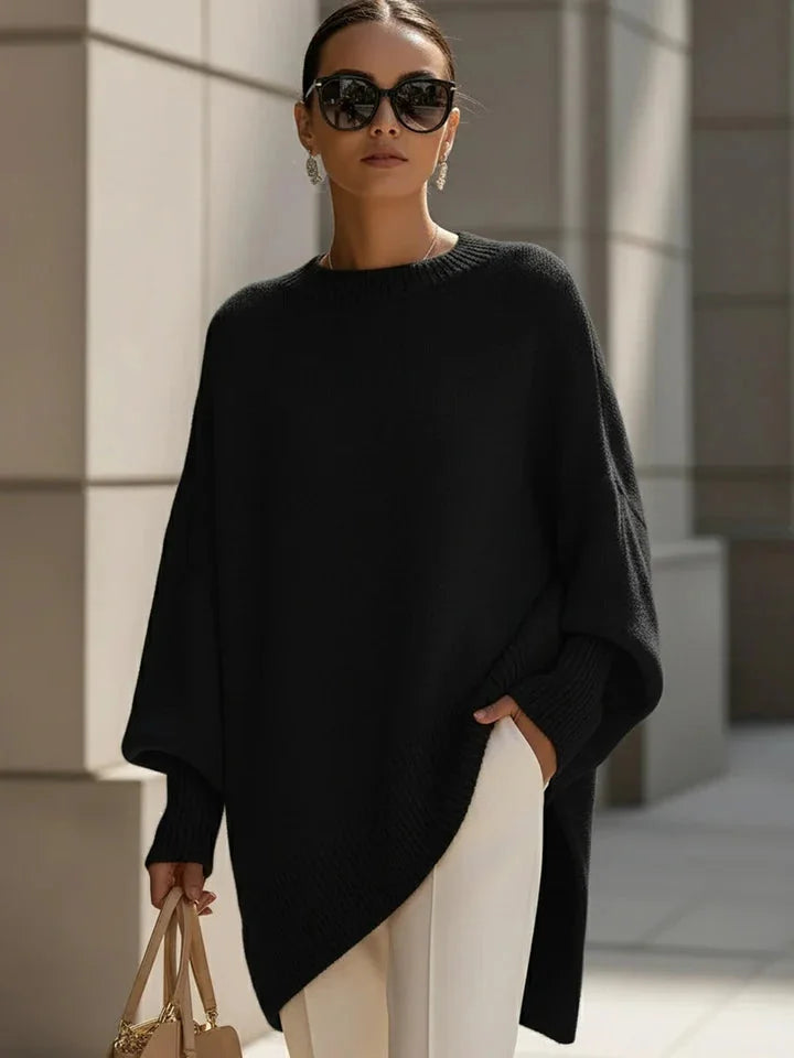 Lucia oversized asymmetric hem sweater in black, worn