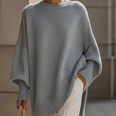 Lucia oversized asymmetric hem sweater in gray, worn