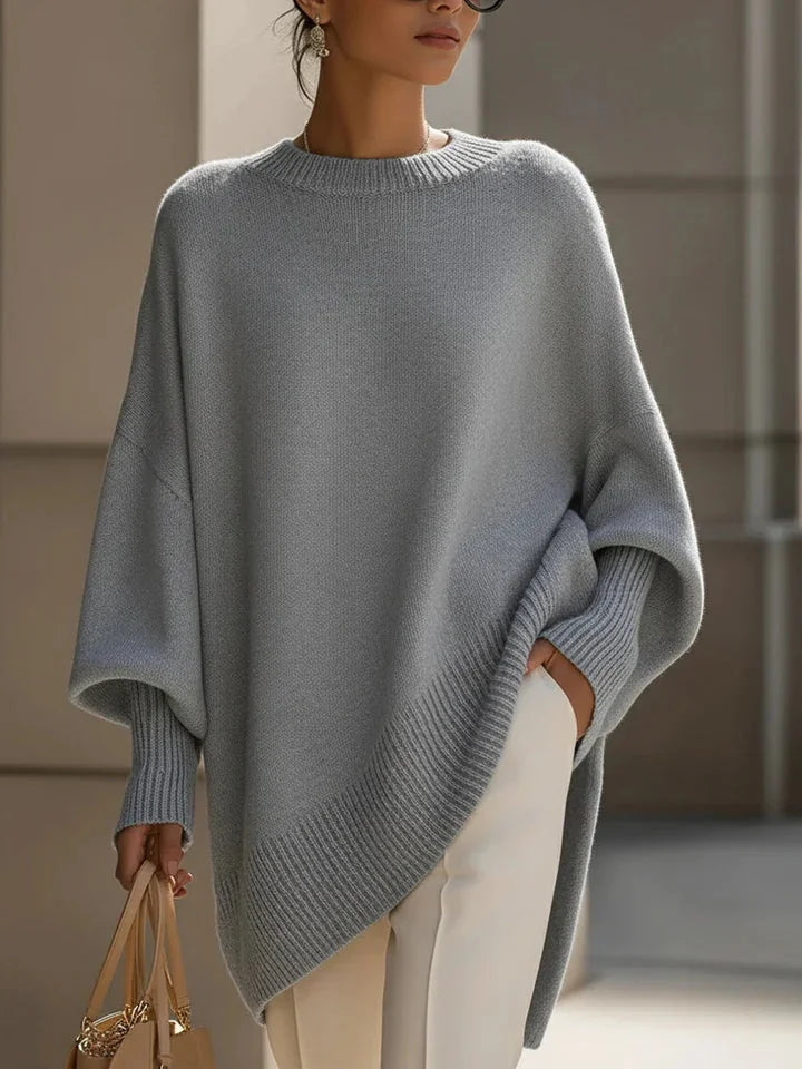 Lucia oversized asymmetric hem sweater in gray, worn