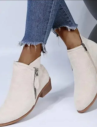 Marisol block heel ankle boots in Ivory, worn