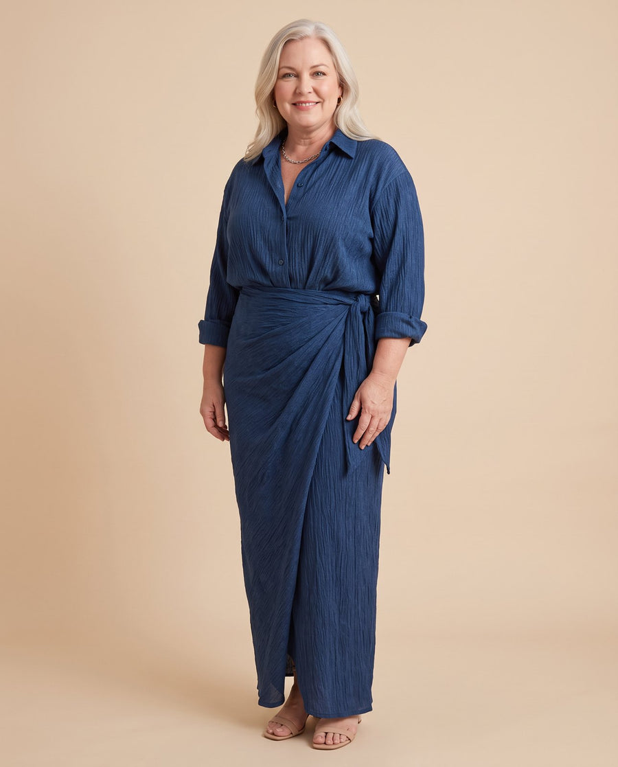 Mirque | Long Sleeve Wrap Front Maxi Dress worn by a woman with curves