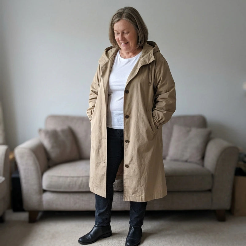 Customer trying on the Andrea hooded longline trench coat in khaki