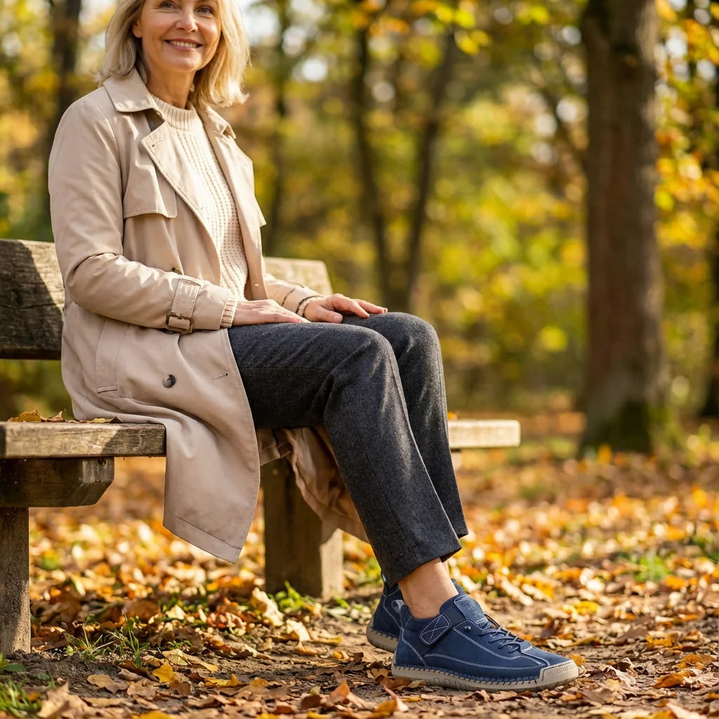 Rosie sneakers in blue, worn with a beige trench coat