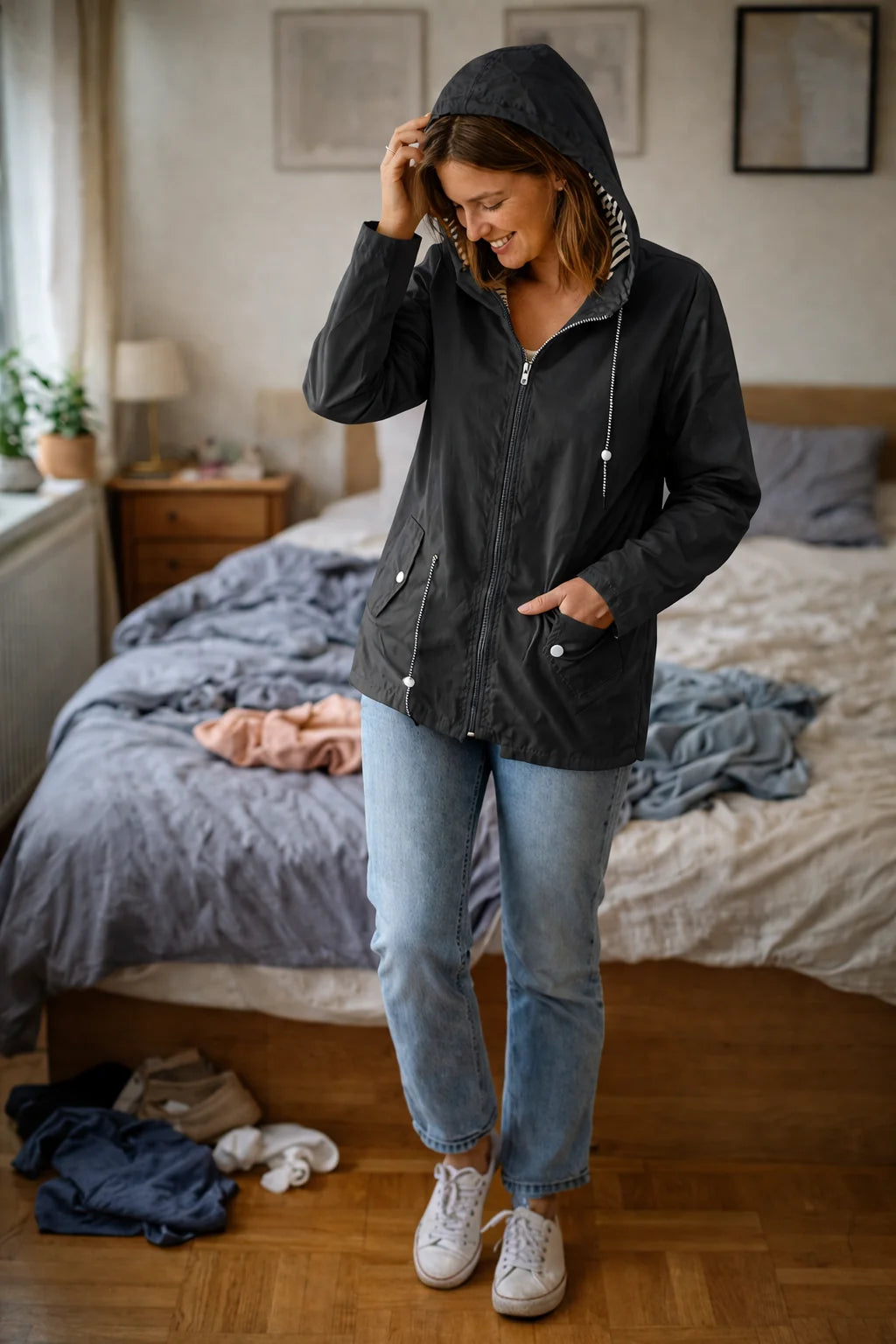 Solange hooded rain jacket in Black, worn