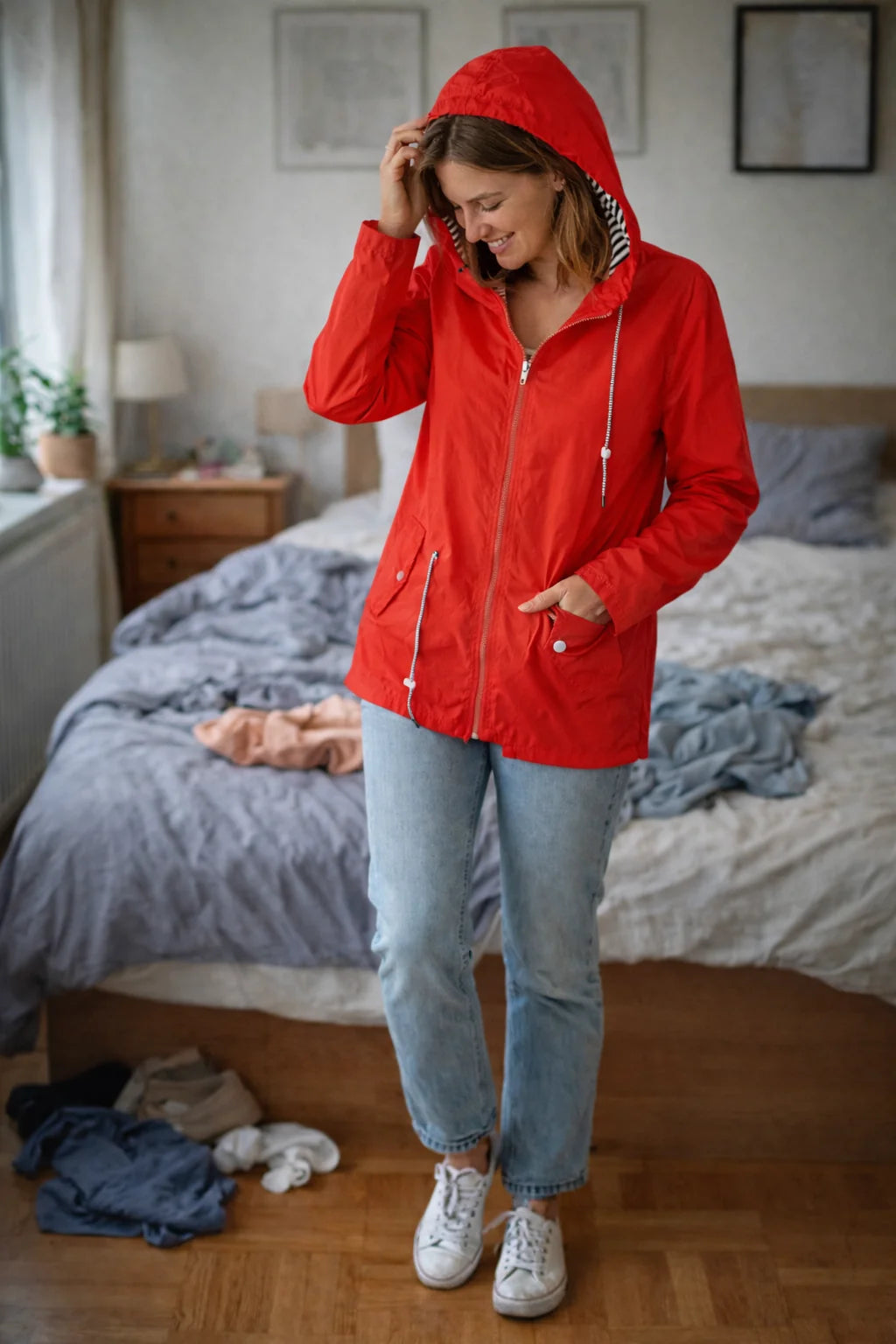 Solange hooded rain jacket in Red, worn
