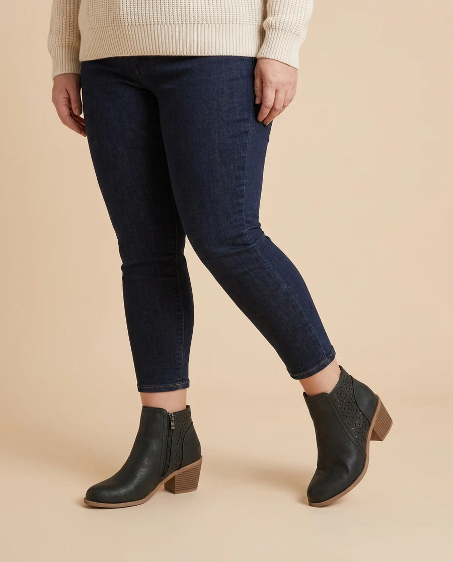 Tessa | Cutout Block Heel Ankle Boots worn by a woman with curves