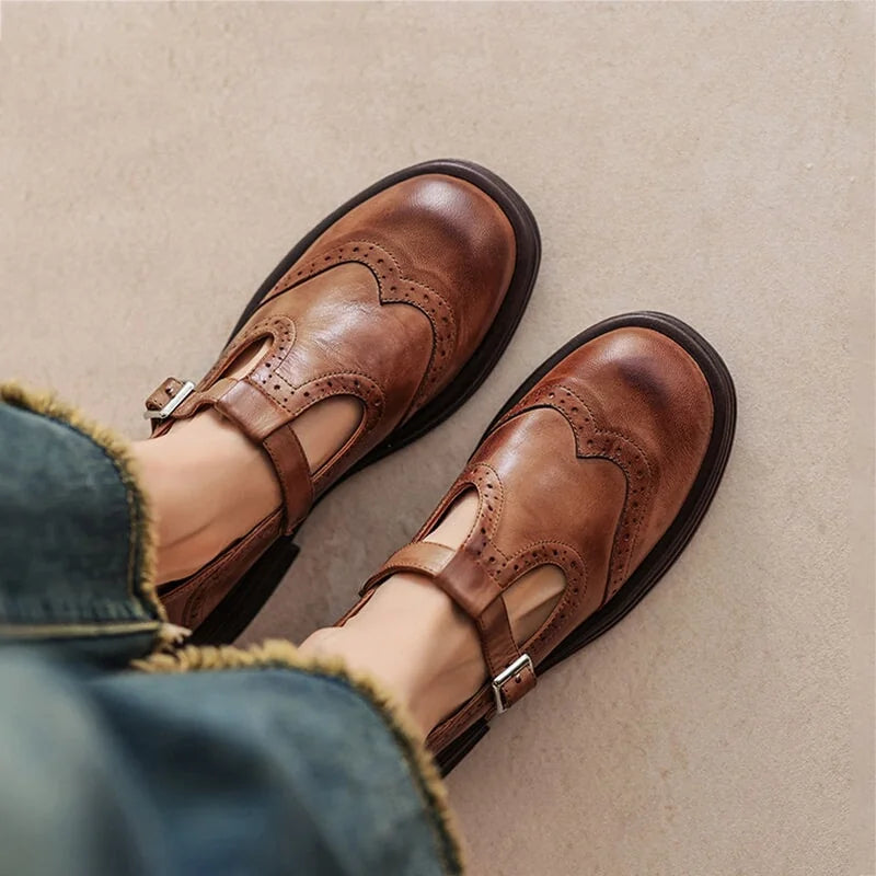 Woman wearing the Verda T-strap shoes in brown with cuffed jeans