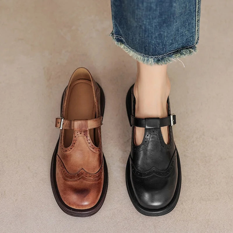 Verda T-strap shoes in brown and black, worn with jeans