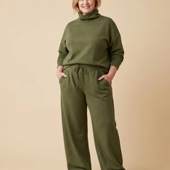 Turtleneck Top & Wide-Leg Pant Set worn by a woman with curves