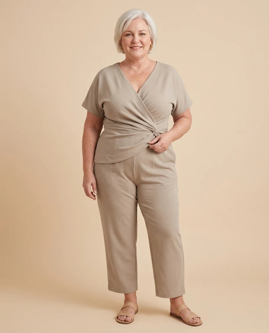 Women's Elegant Long Sleeve Top and Wide Leg Trouser Two-Piece Set worn by a woman with curves
