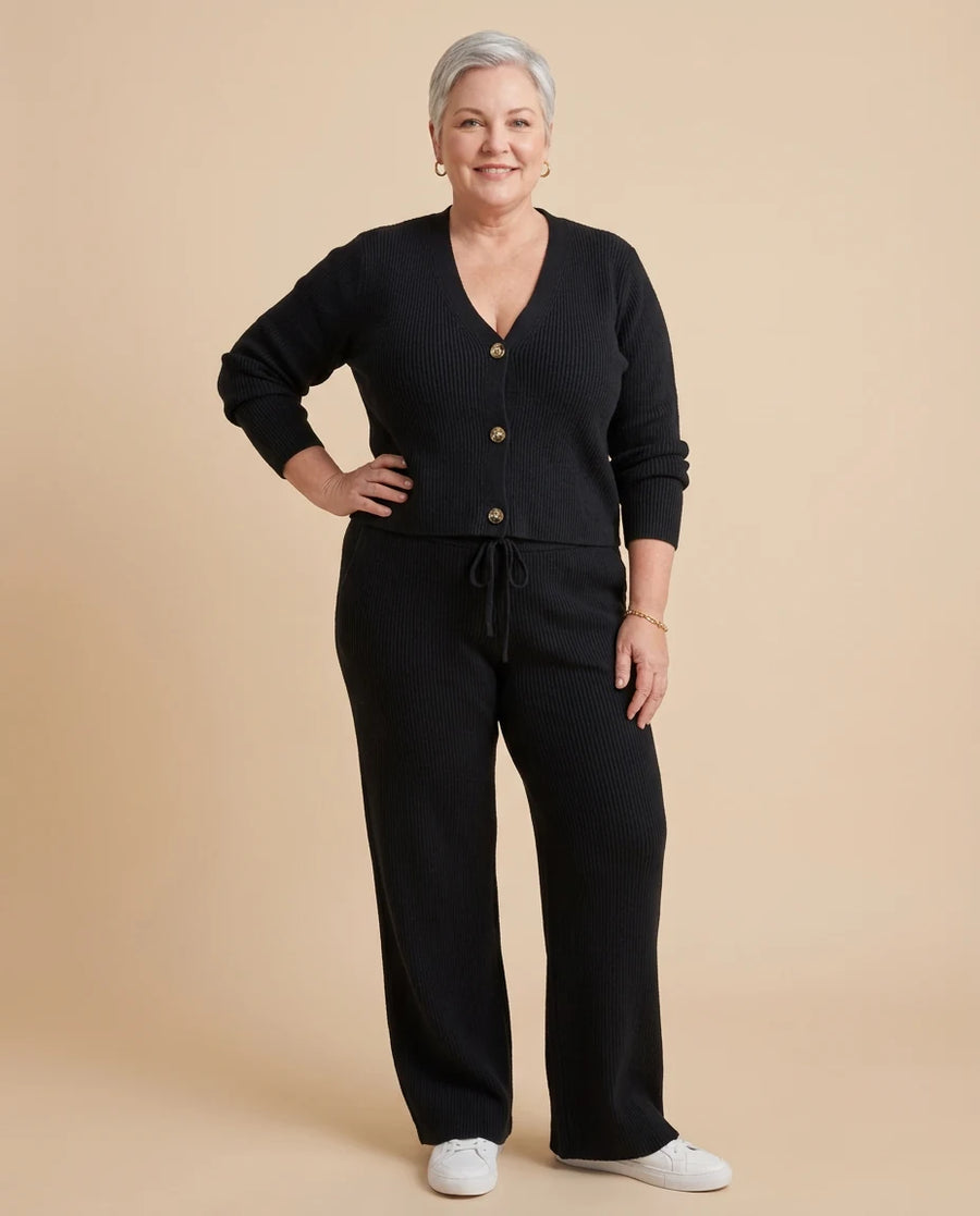 Women's Knit Cardigan and Wide Leg Trouser Two-Piece Set worn by a woman with curves