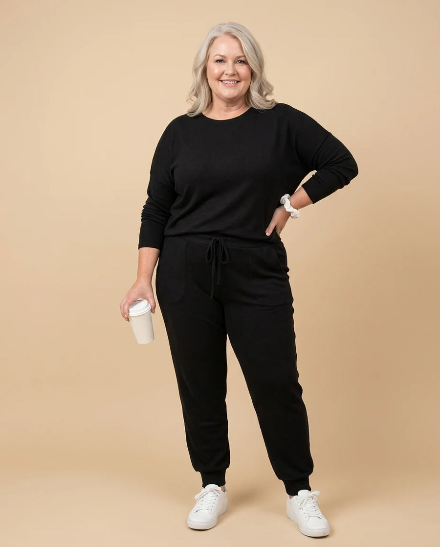 Women's Stylish Two-Piece Top and Trouser Coordinated Set worn by a woman with curves